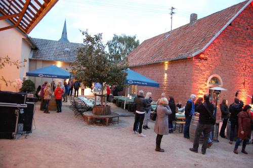 a group of people standing outside of a building at HEINRICHs winery bed & breakfast in Langenlonsheim