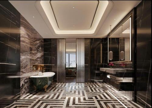 a bathroom with a tub and a sink at Phoenix Crowne Vinh Hotel in Vinh