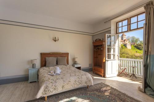 En eller flere senge i et værelse på Maison du Gave