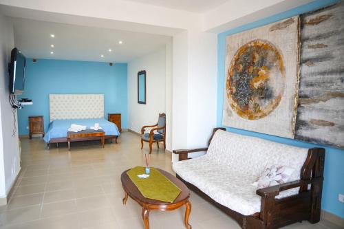 a living room with a couch and a bed at Belvedere di Ciro' in Cirò