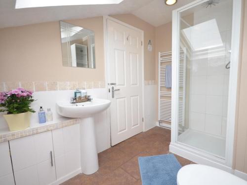 a bathroom with a sink and a shower at 2 Bed in Crediton oc-51275 in Stockleigh Pomeroy
