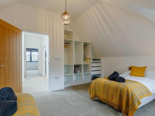 a bedroom with two beds and a large mirror at 3 Bed in Holsworthy oc-90721 in Holsworthy