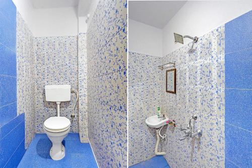 a blue bathroom with a toilet and a sink at FabHotel The Radium Inn in Rānchī
