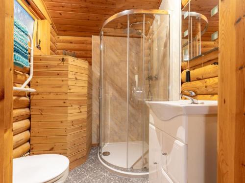 a bathroom with a shower and a toilet and a sink at 2 Bed in Bideford oc-00370 in Clovelly