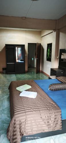 a room with two large beds in it at Redbull guest house in Pattaya