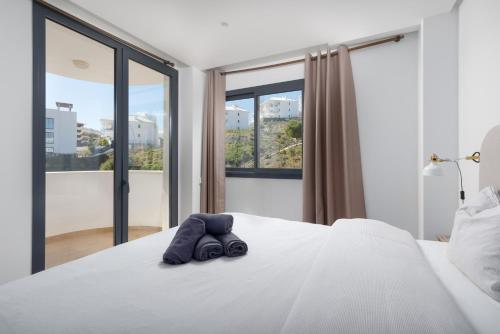 Paula Lemac - Stylish El Higueron Apartment with Sea Views, Spacious Terrace & Comfort
