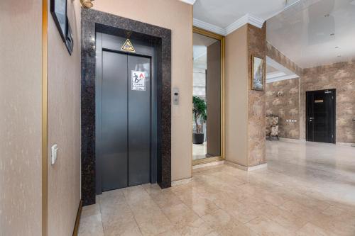 a hallway with a elevator in a building at Kalasi Hotel in Tbilisi City