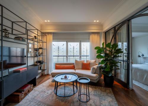 a living room with a couch and a table at Hovagimyan Hotel and Suites in Istanbul