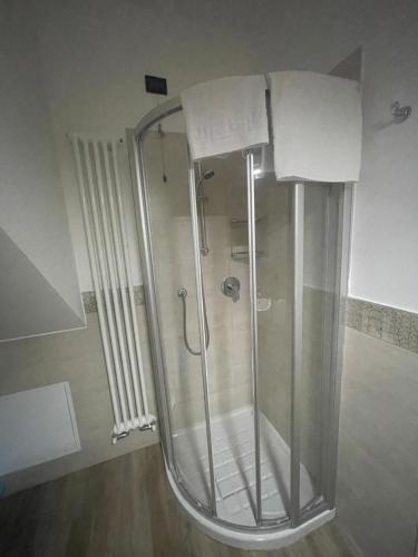 a shower with a glass door in a bathroom at Villa Aurora Apartments in Sirmione