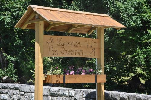 a wooden sign with a roof on top of it at Turistična kmetija Pri Rebkovih in Ajdovščina