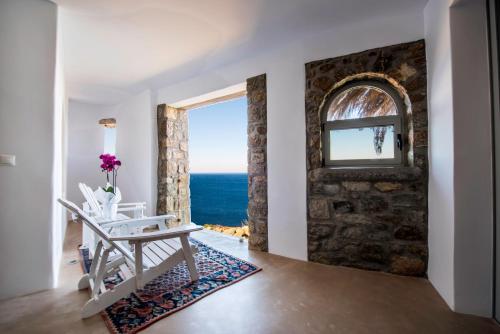 a room with a view of the ocean at Greco Philia Hotel Boutique by Mr and Mrs White in Elia Beach