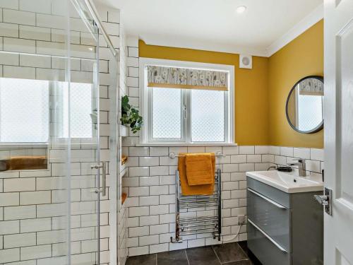 a bathroom with a shower and a sink at 2 Bed in Taunton oc-96234 in West Quantoxhead