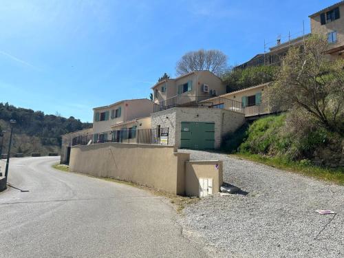 a house on the side of a road at L'échappée du Verdon in Esparron-de-Verdon