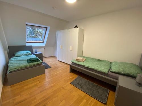 a bedroom with a bed and a small cabinet at modern ausgestatte "GS2613" Gästewohnung im Zentrum Merseburgs in Merseburg