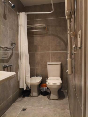 a bathroom with a toilet and a sink at Lido in Mar del Plata