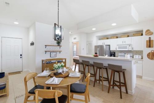 a kitchen and dining room with a table and chairs at 2B 2B Lake View Pool Hot Tub in Lake Ozark