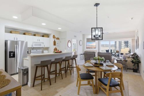 a kitchen and living room with a table and chairs at 2B 2B Lake View Pool Hot Tub in Lake Ozark