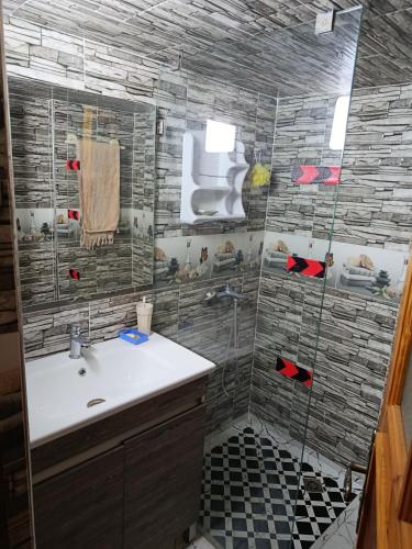 a bathroom with a sink and a shower at villa ourika complette in Sbiti