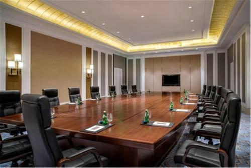 a large conference room with a long table and chairs at Sofitel Shanghai Hongqiao in Shanghai