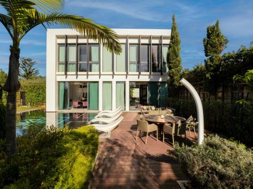 a house with a pool and a table and chairs at STORY Rabat in Rabat