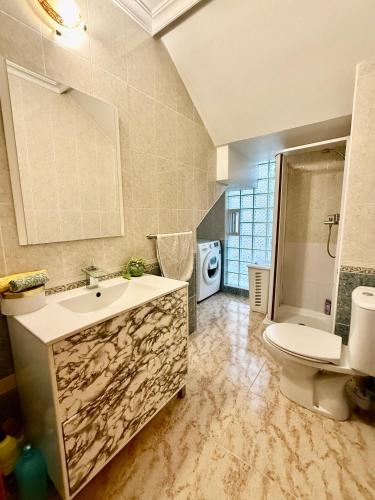 a bathroom with a sink and a toilet at Mar y Golf in Orihuela Costa