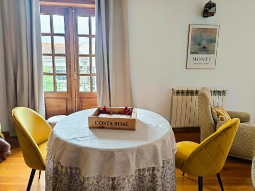 a room with a table with a box on it at Casa Vitral - Stained Glass House in Miranda do Douro