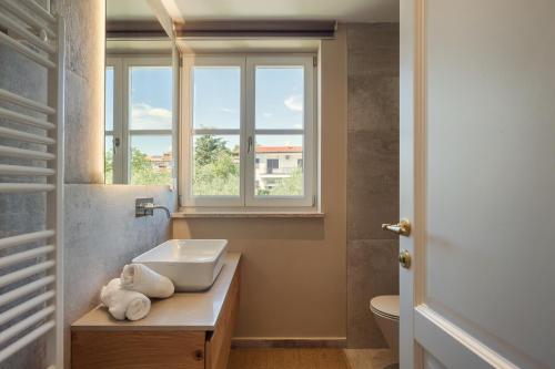 a bathroom with a sink and a window at Villa Natalie in Vabriga