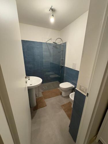 a bathroom with a toilet and a sink and a shower at Palazzo Bosco in Cosenza