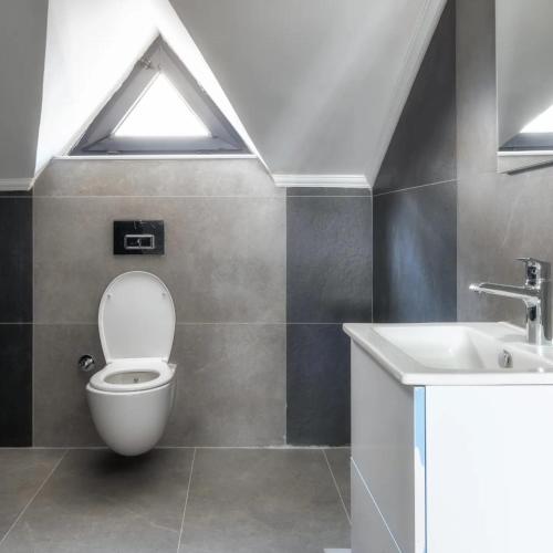 a bathroom with a toilet and a sink at canyon villa in Kemer