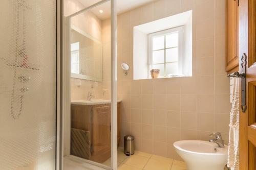 a bathroom with a shower and a sink at Gîte G175 in Grosville