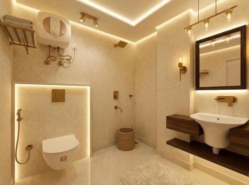 a bathroom with a toilet and a sink and a mirror at Hotel Olive Aero Suites Near Delhi IGI Airport in New Delhi