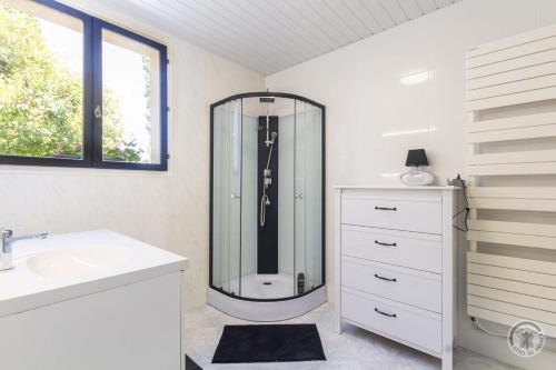 a bathroom with a shower and a sink at Gîte G1255 in Tribehou