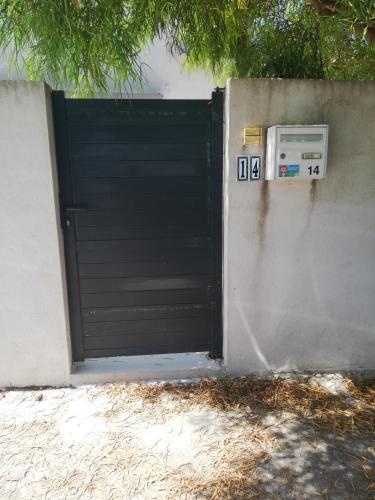 Les Palmiers, T2 confortable en rez de jardin, bord de mer, terrasse