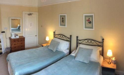 Ένα ή περισσότερα κρεβάτια σε δωμάτιο στο The Aidan Guest House