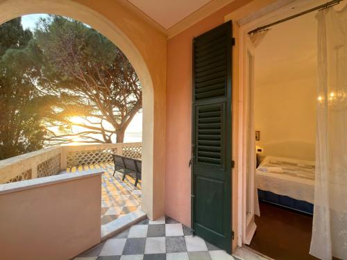 an open door to a room with a bed at VILLA MARE BLU in Levanto