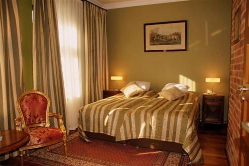 
Łóżko lub łóżka w pokoju w obiekcie Moszna Apartments
