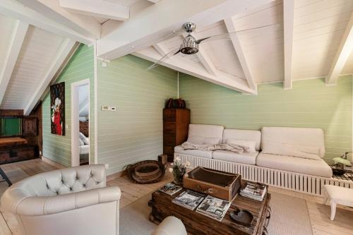 a living room with a couch and a table at Le Vetrate sul Lago Lake Como Amazing View in Nesso