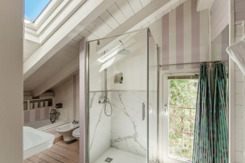 a bathroom with a shower and a sink at Le Vetrate sul Lago Lake Como Amazing View in Nesso