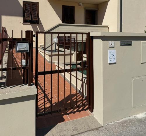 an iron gate with a staircase in a building at Balo’s home in Venturina Terme