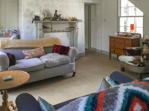 a living room with a couch and a table at Campbells Stables in Berwick-Upon-Tweed