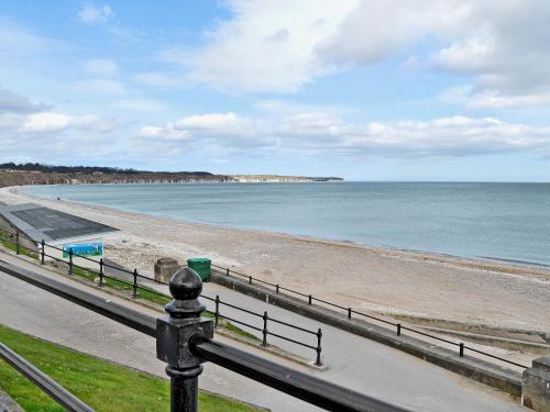 a view of a beach and the ocean at The Bait Shed in Filey