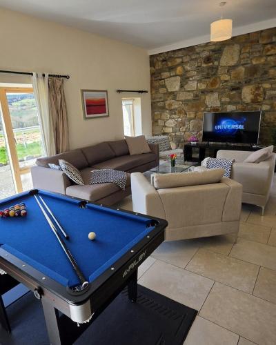 a living room with a pool table in it at Ballycrystal House Getaway in Bunclody
