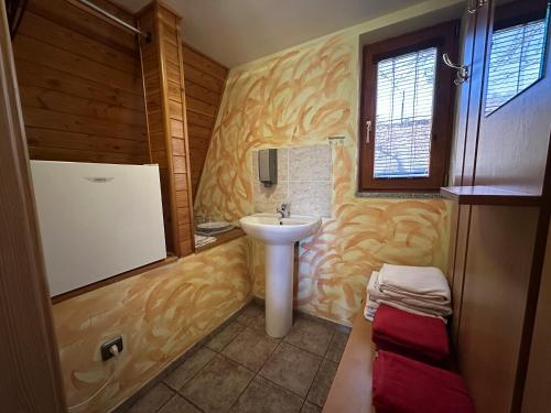a bathroom with a sink and a toilet in it at Resort Hulín in Sedlčany
