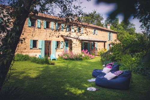 a house with two bean bags in the yard at PranaVita, B&B Naturale in Pesaro