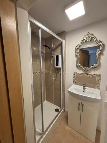 a bathroom with a shower and a sink at A beautiful 2-bedroom Apartment in Skegness