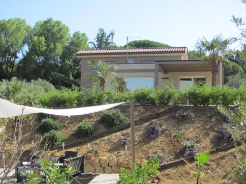 a house with a garden in front of it at Folco Studio Apartment in Piazza Armerina
