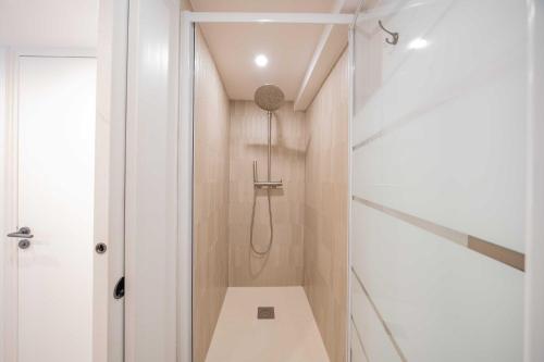 a bathroom with a shower with a toilet in it at Studio in a residence with pool - Saint-Tropez in Saint-Tropez