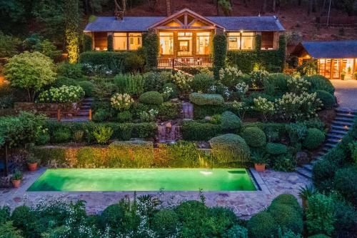 a house with a garden and a swimming pool at Morlet Hilltop House in St. Helena