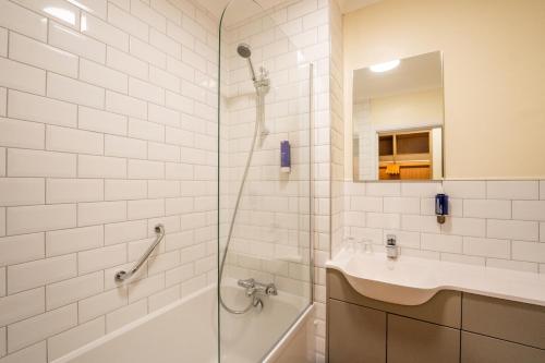 a bathroom with a shower and a sink at Southview Park Hotel in Skegness