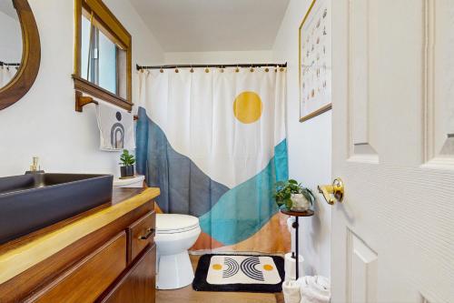 a bathroom with a sink and a toilet at Boat, Hike, Fish! Summer Cabin Near Lake Arrowhead in Running Springs